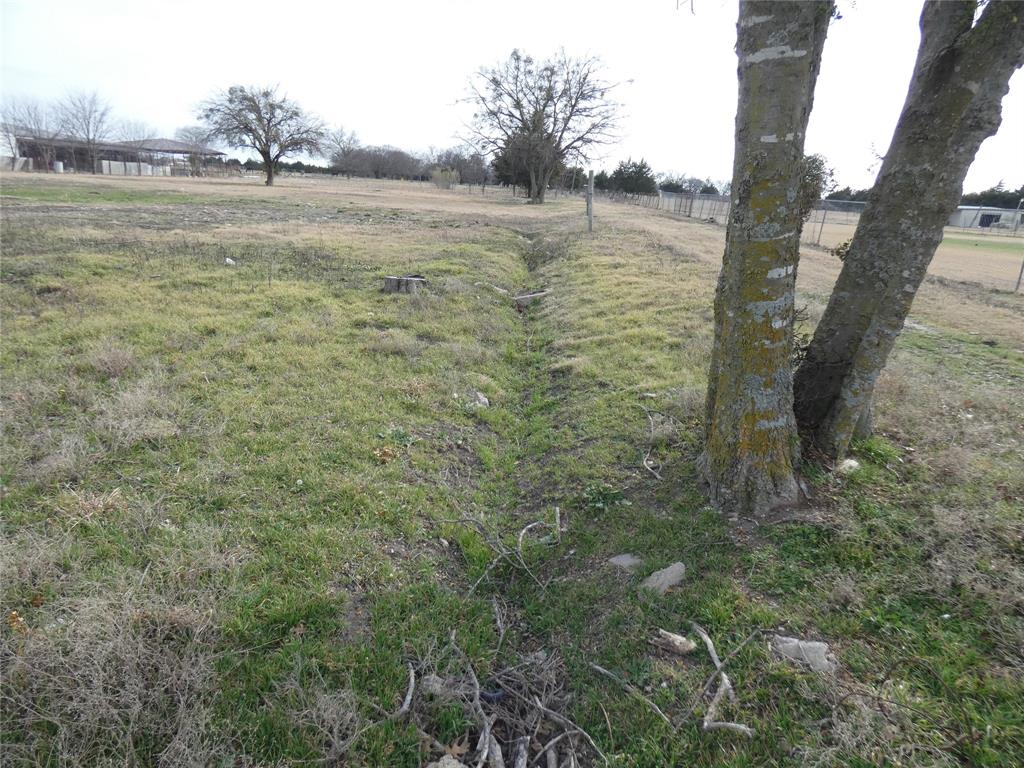 632 East Reindeer Road Lancaster, TX 75146 - Photo 15 of 24 a view of a lake with a yard