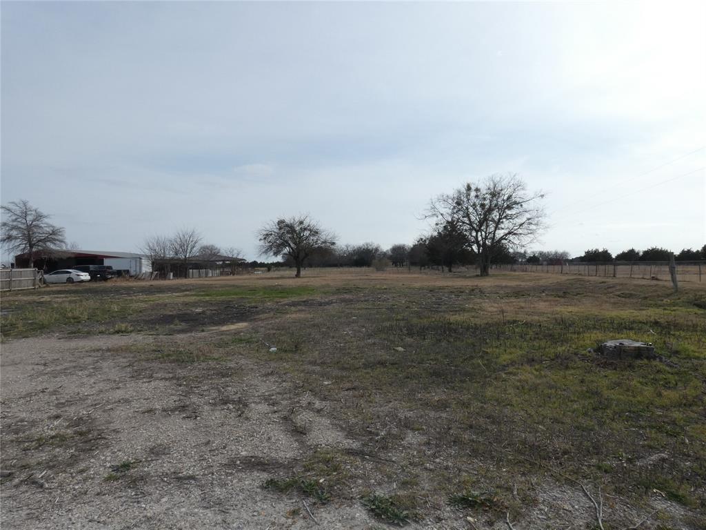 632 East Reindeer Road Lancaster, TX 75146 - Photo 18 of 24 a view of a field with trees in background