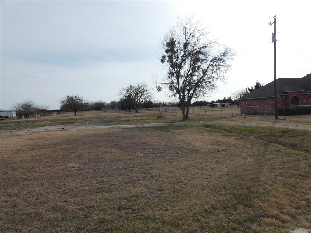 632 East Reindeer Road Lancaster, TX 75146 - Photo 19 of 24 a view of dirt field with trees