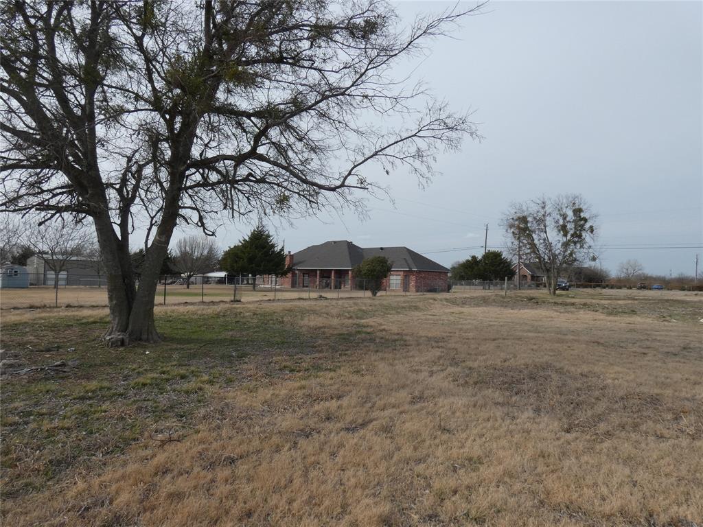 632 East Reindeer Road Lancaster, TX 75146 - Photo 2 of 24 a view of a yard with a tree
