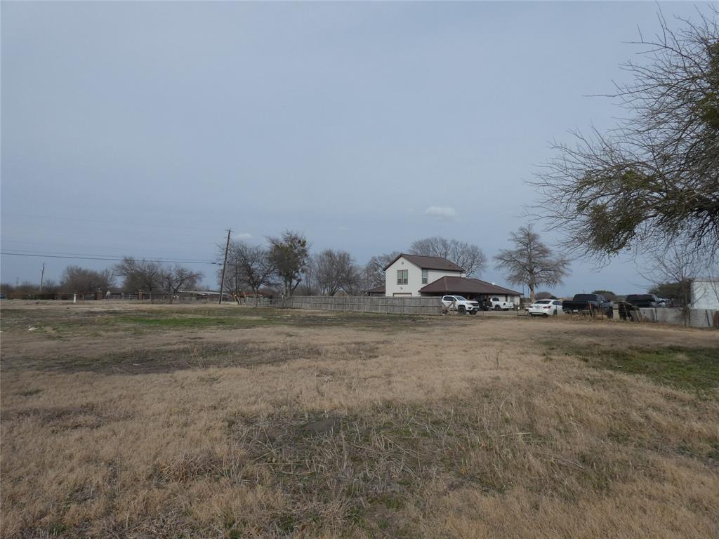 632 East Reindeer Road Lancaster, TX 75146 - Photo 3 of 24 a view of a field and trees