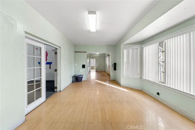 a big room with closet and windows