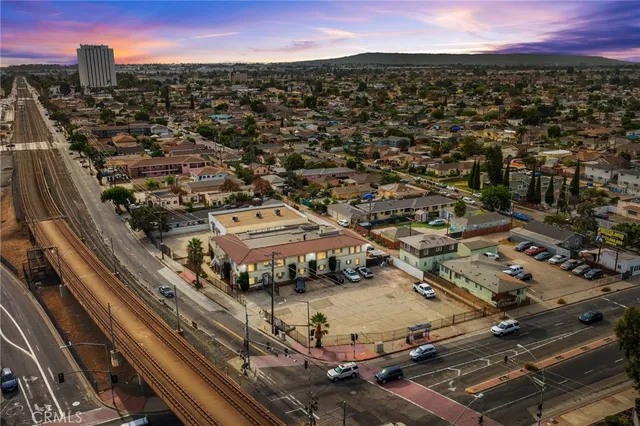 an aerial view of residential houses with city view