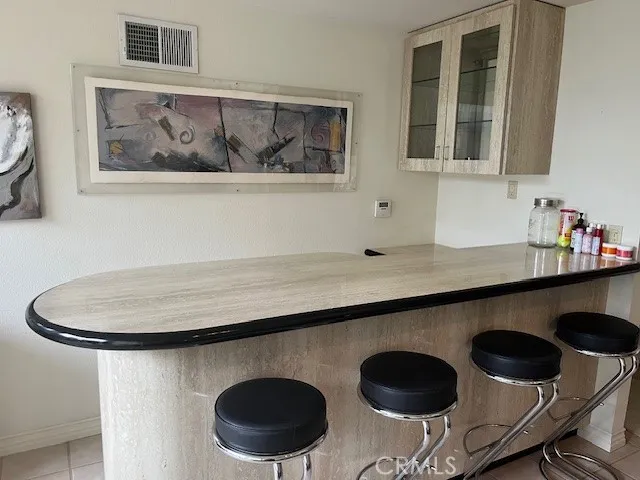 a view of a sink and a refrigerator in it