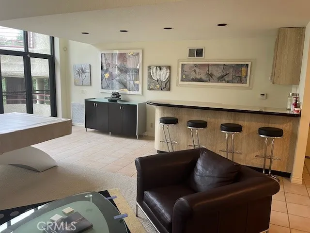 a view of a dining room with furniture and window