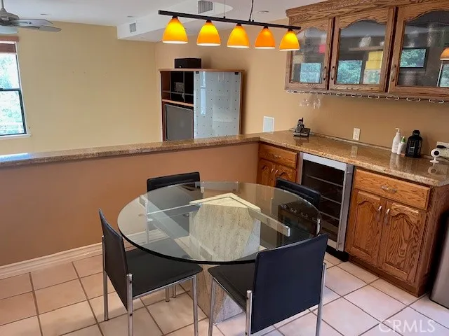 a kitchen with a refrigerator a sink and cabinets