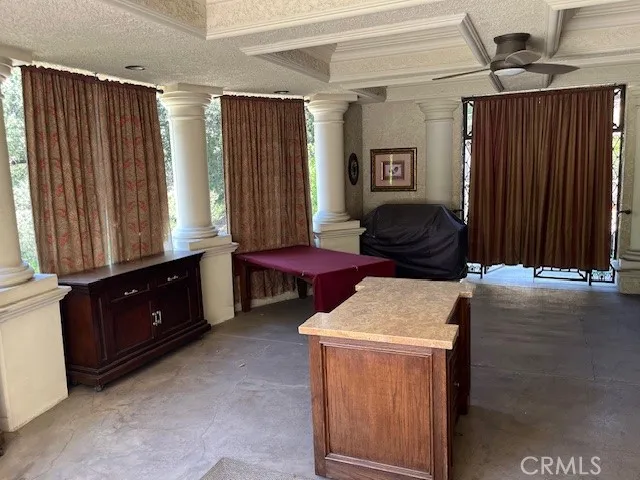 a view of a workspace with furniture