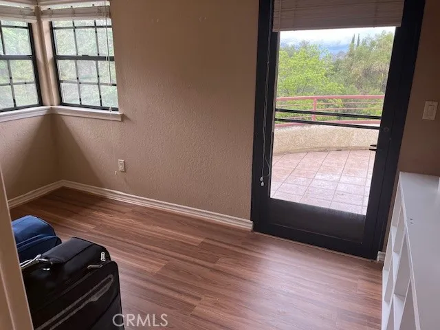 a large bed sitting in a bedroom and a lamp