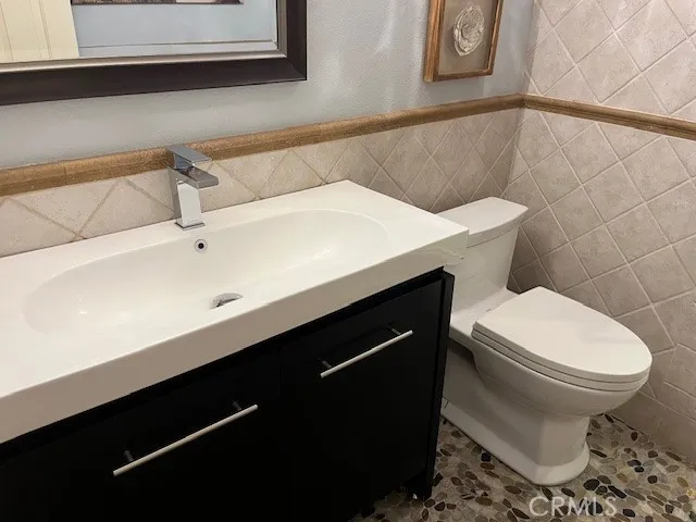 a kitchen with a stove and a refrigerator