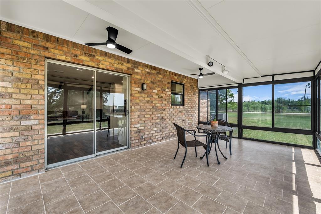 299 Aggie Way China Spring, TX 76633 - Photo 10 of 29 Screened porch completely closes off to become a 4 seasons room for year-round use.