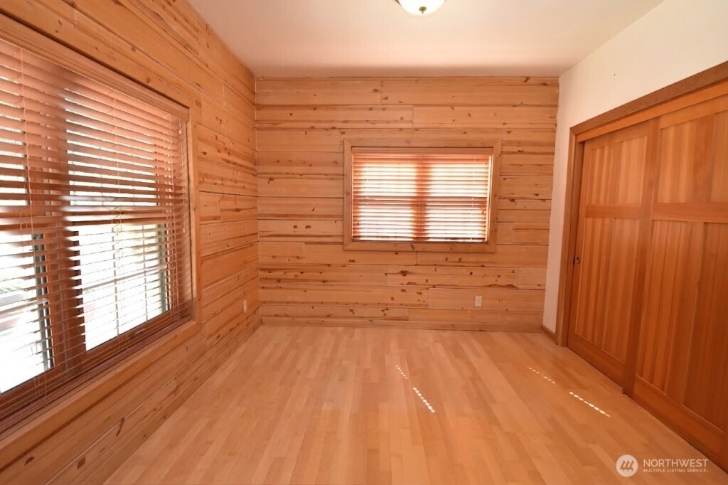 30333 Heimer Road Arlington, WA 98223 - Photo 23 of 40 a view of a room with a wooden floor and a window