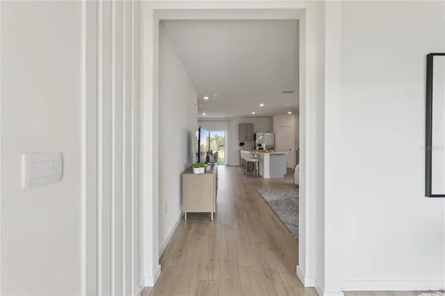 a view of a living room with a hallway