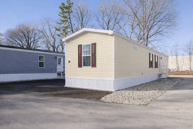 a kitchen with stainless steel appliances a refrigerator stove and microwave