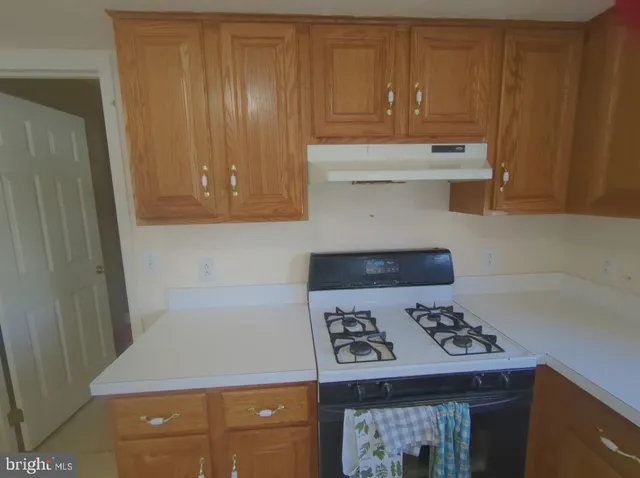 a kitchen with a stove and a microwave
