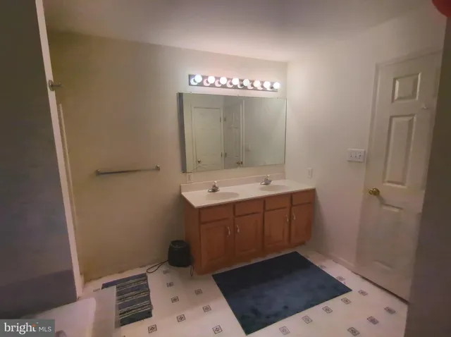 a bath room with a toilet and a bath tub