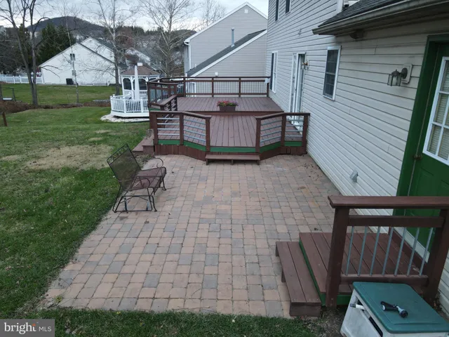 a view of a chairs setting in the backyard