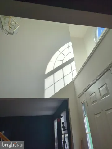 a view of empty room with windows