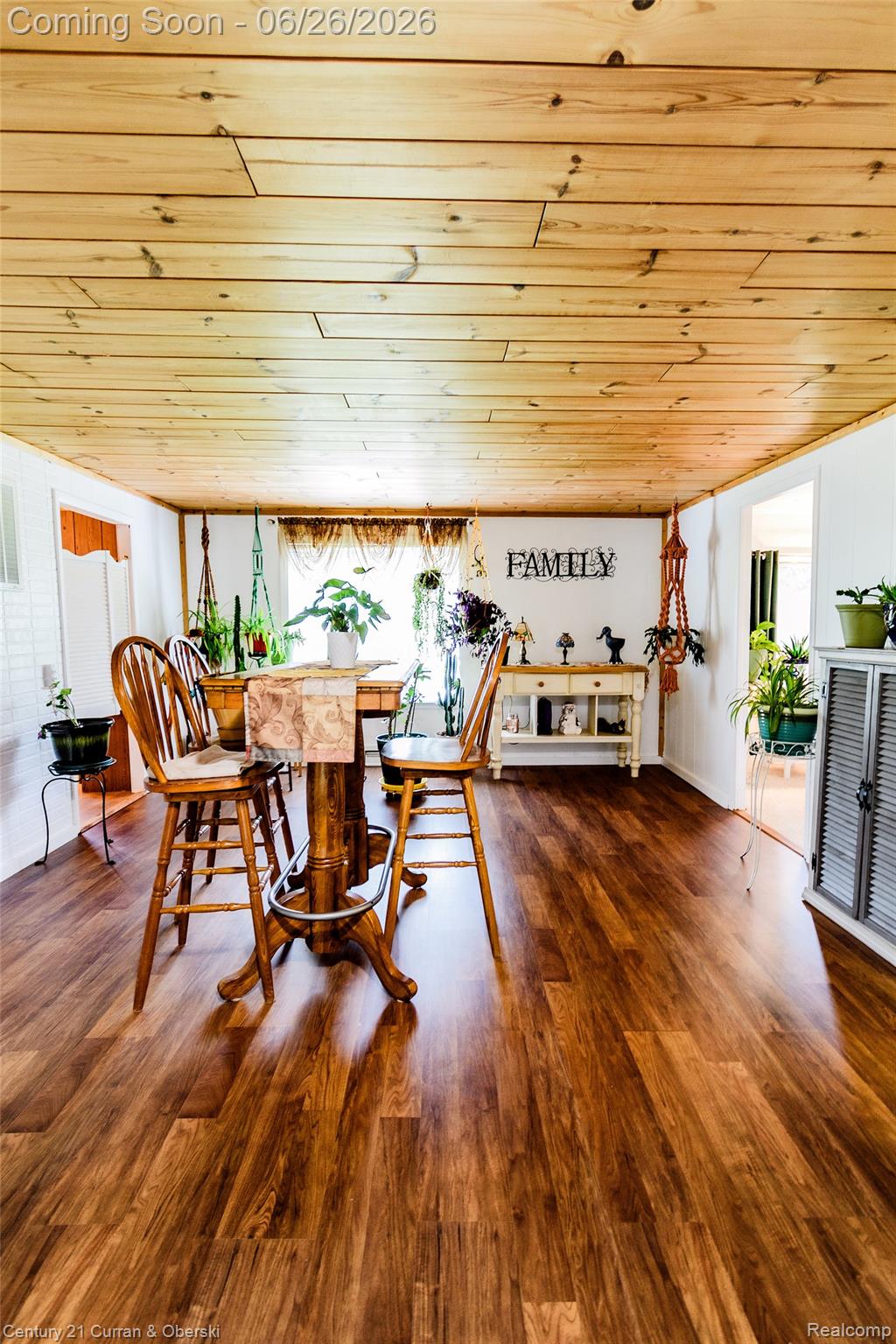 3270 Woods Road Harrison, MI 48625 - Photo 19 of 42 Wood-finish flooring complemented by a paneled wood ceiling