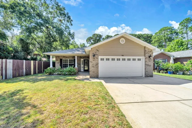 a view of house with yard