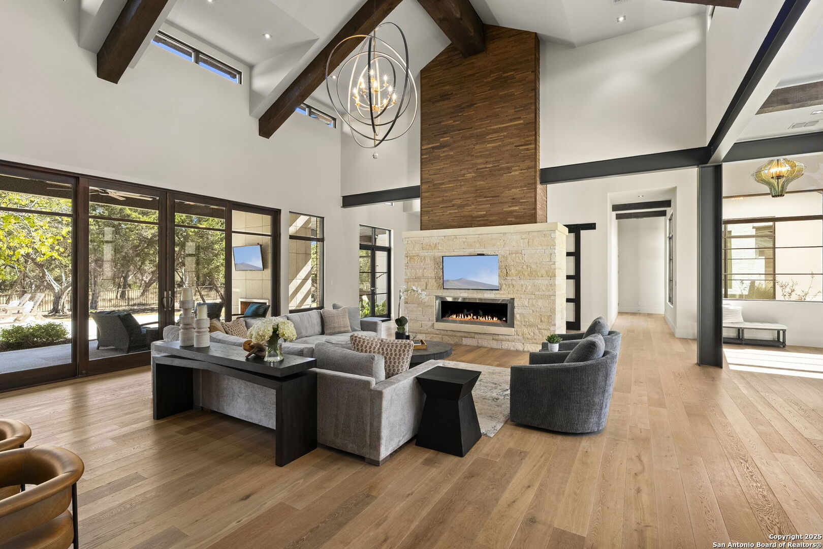 116 Sendero Ridge Boerne, TX 78006 - Photo 12 of 58 a living room with furniture a large window a flat screen tv and outdoor seating