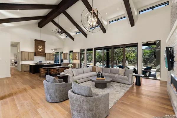 a large kitchen with a table and chairs