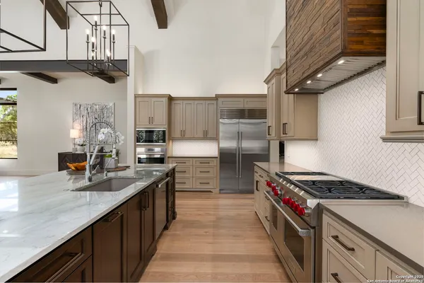 a kitchen with granite countertop a window and a sink