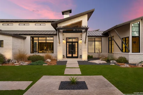 a front view of a house with garden