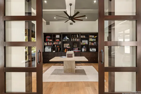 a spacious bedroom with a bed and a fireplace