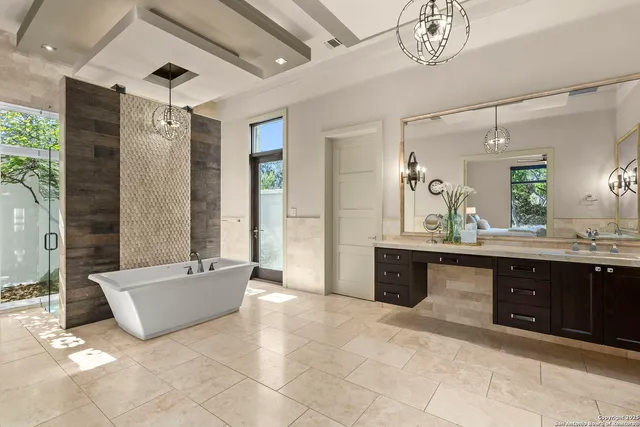 a bathroom with a glass shower door