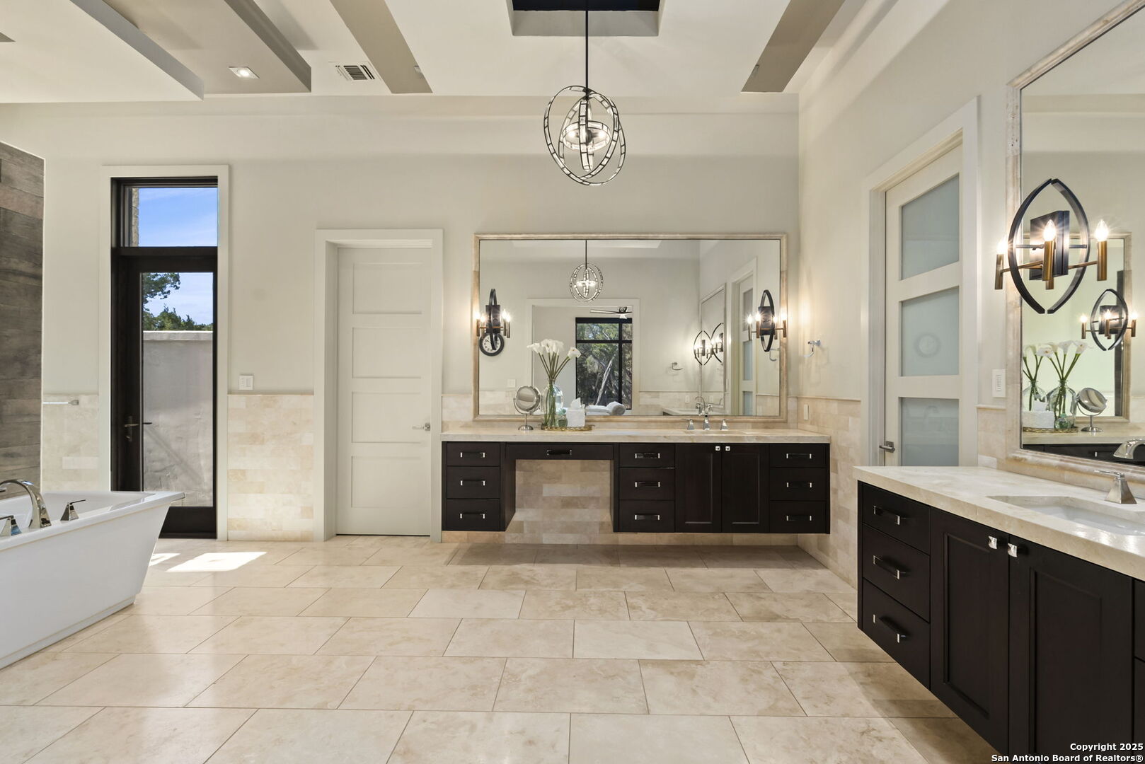 116 Sendero Ridge Boerne, TX 78006 - Photo 33 of 58 a spacious bathroom with a sink a vanity a mirror and bathtub