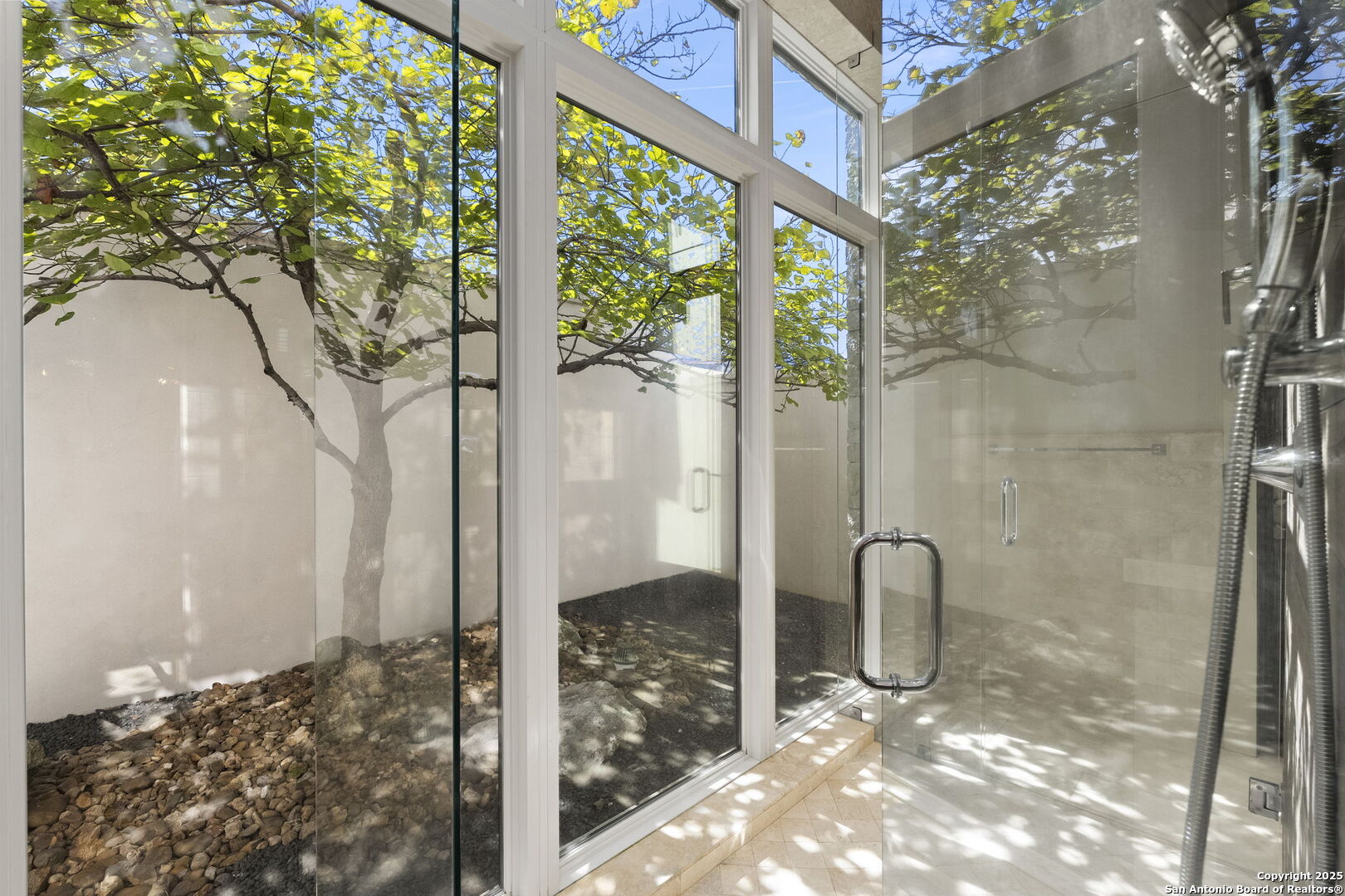 116 Sendero Ridge Boerne, TX 78006 - Photo 36 of 58 a bathroom with a glass shower door