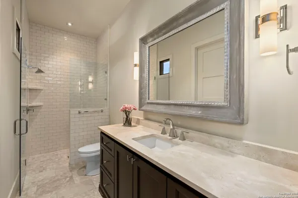 a bathroom with a bathtub and shower