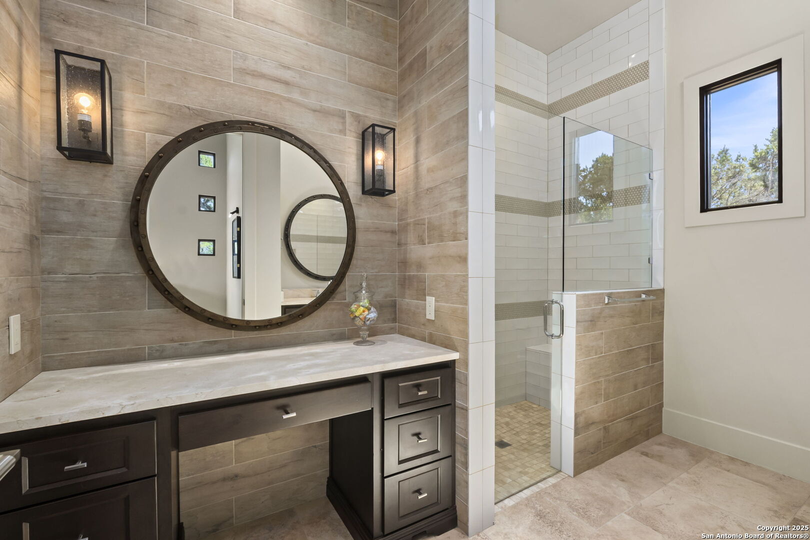 116 Sendero Ridge Boerne, TX 78006 - Photo 42 of 58 a bathroom with a sink a mirror a vanity and a shower