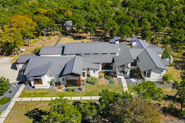 an aerial view of a house with a garden