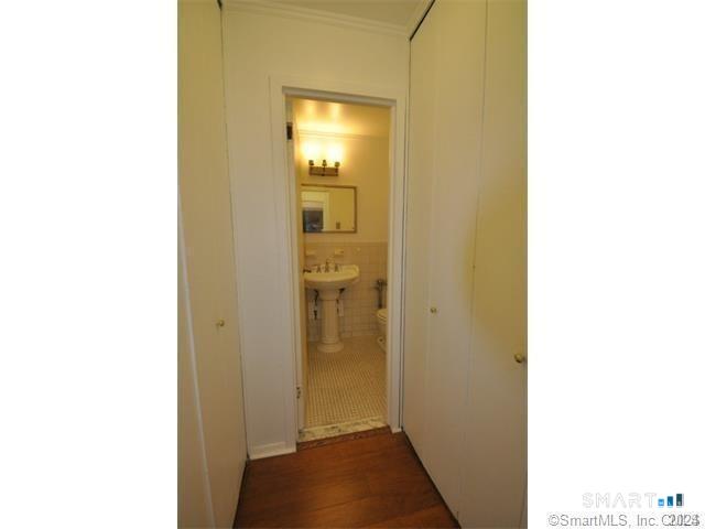 99 Prospect Street, Unit 5M Stamford, CT 06901 - Photo 6 of 10 a view of a bathroom from a hallway