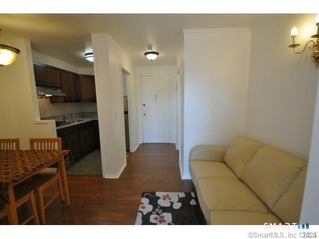 99 Prospect Street, Unit 5M Stamford, CT 06901 - Photo 9 of 10 a living room with furniture and a flat screen tv