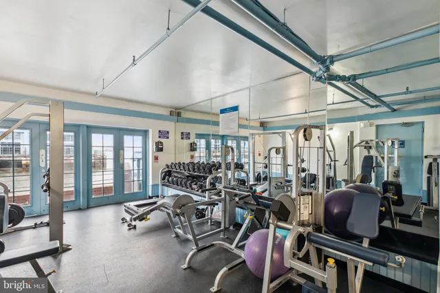 a view of a kitchen with a sink and cabinets