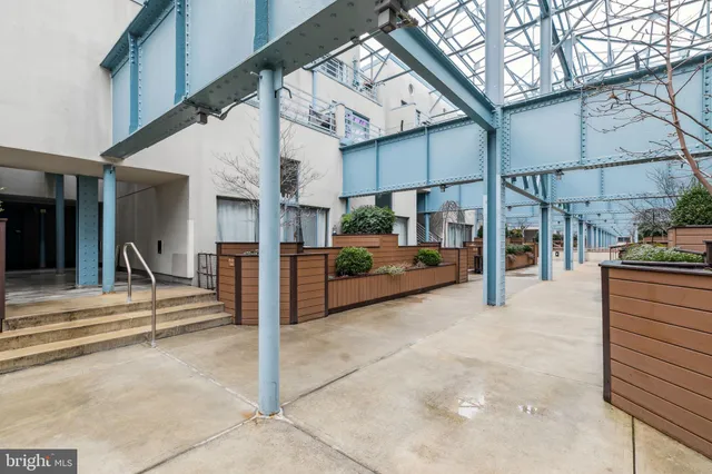 a kitchen with stainless steel appliances kitchen island granite countertop a sink and cabinets