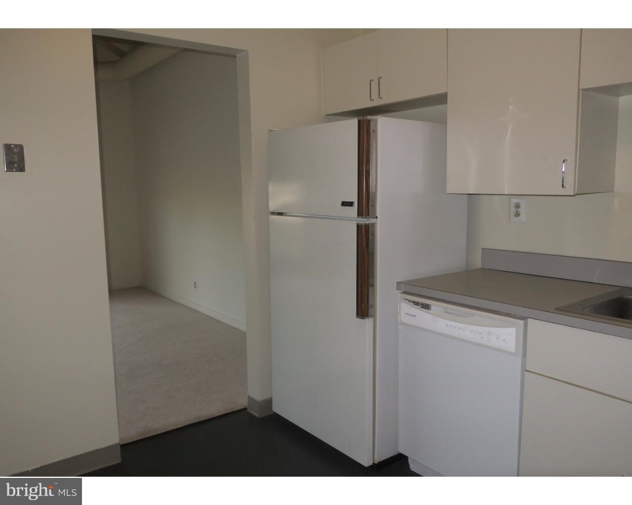 3 North Christopher Columbus Boulevard, Unit 405 Philadelphia, PA 19106 - Photo 5 of 20 a kitchen with a refrigerator and a stove
