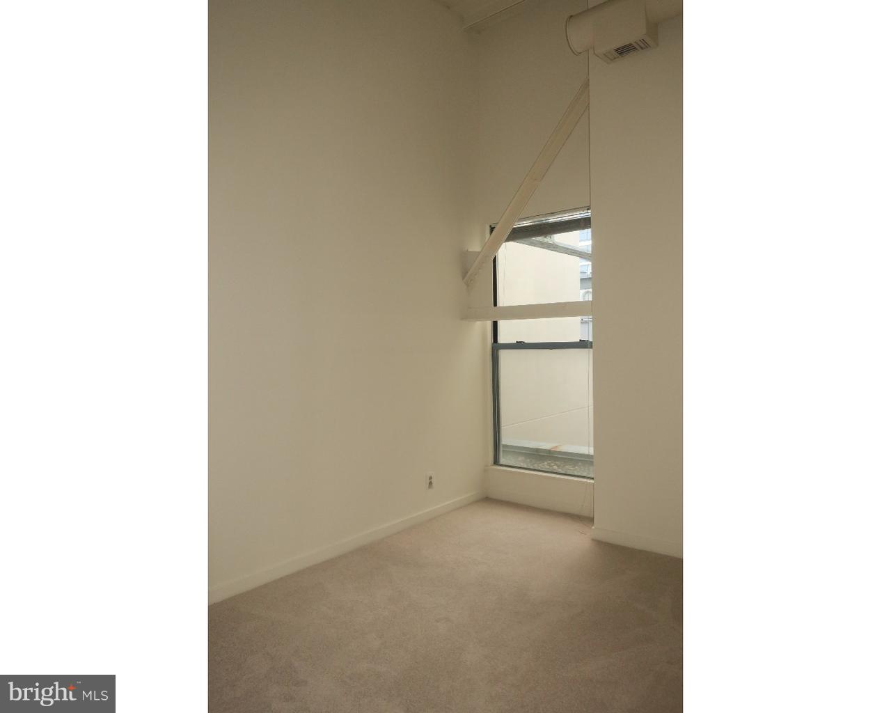 3 North Christopher Columbus Boulevard, Unit 405 Philadelphia, PA 19106 - Photo 6 of 20 a view of an empty room with a window