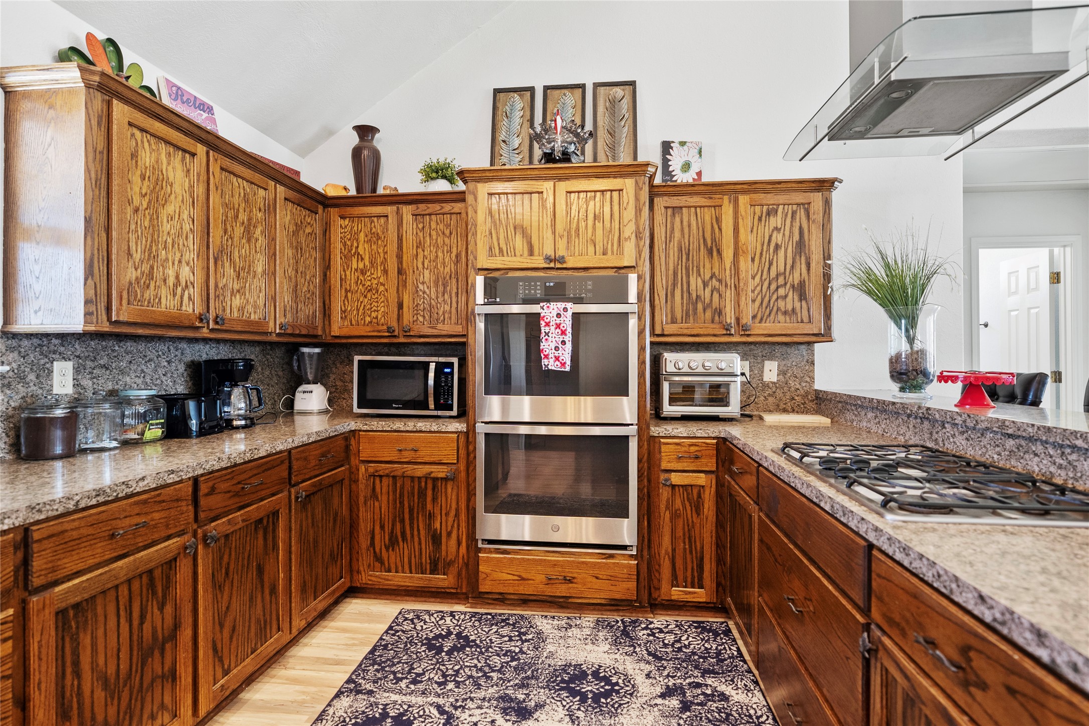 6776 Farm To Market Road 356 Trinity, TX 75862 - Photo 13 of 50 a kitchen with stainless steel appliances granite countertop a stove and a refrigerator