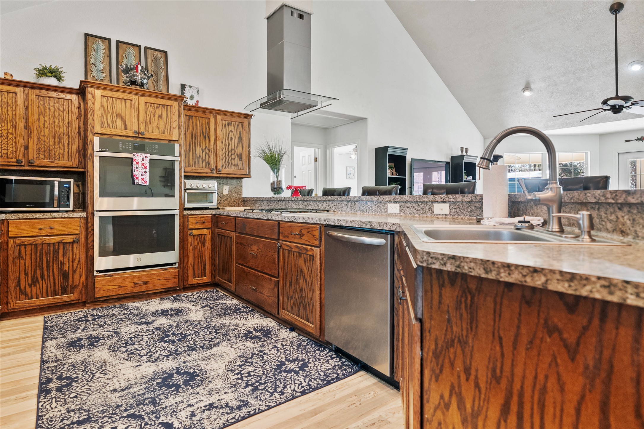 6776 Farm To Market Road 356 Trinity, TX 75862 - Photo 14 of 50 a kitchen with stainless steel appliances granite countertop a sink dishwasher stove and oven
