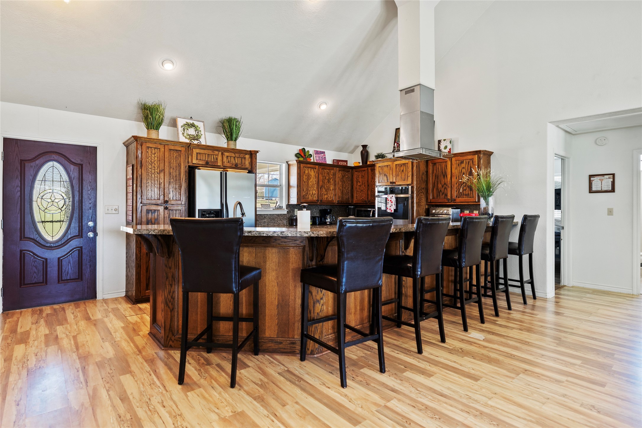 6776 Farm To Market Road 356 Trinity, TX 75862 - Photo 22 of 50 a dining room filled chandelier and wooden floor