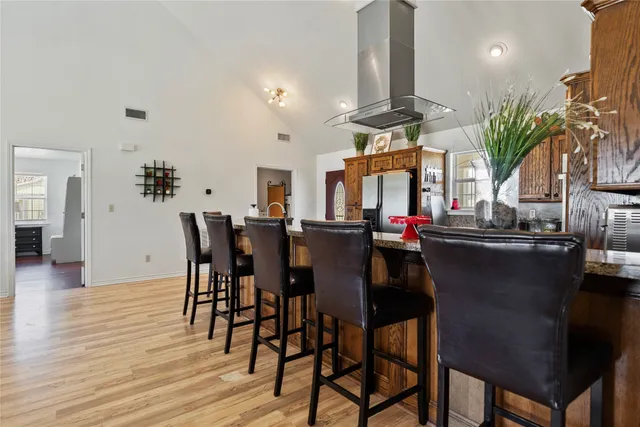 a view of a dining room with furniture and chandelier
