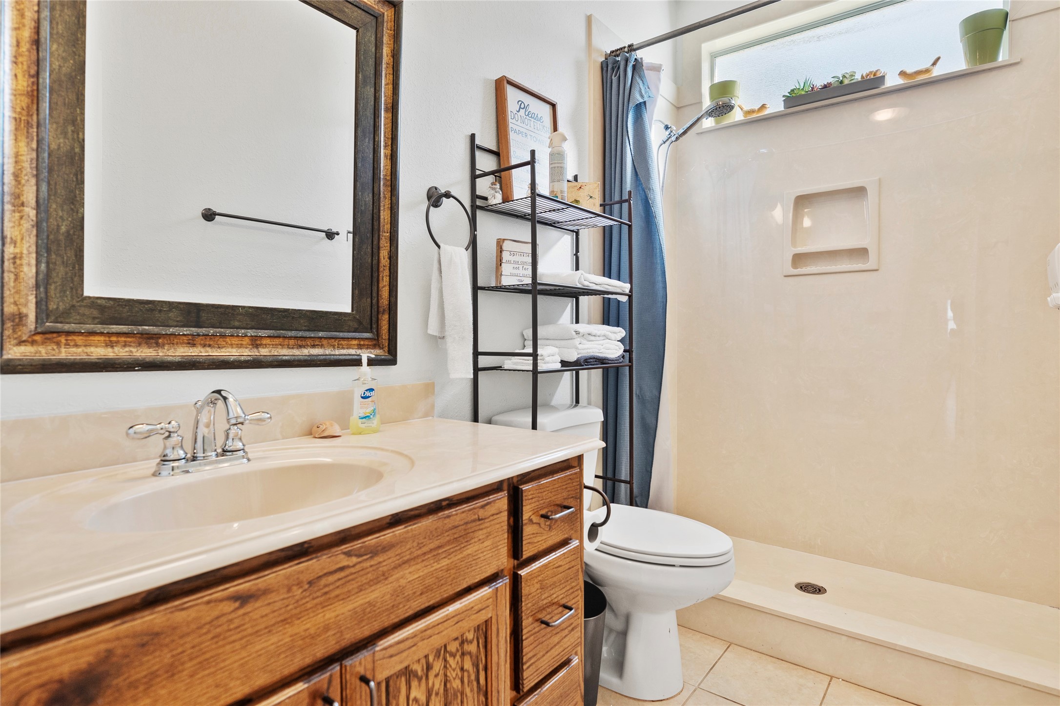 6776 Farm To Market Road 356 Trinity, TX 75862 - Photo 32 of 50 a bathroom with a sink a toilet and shower