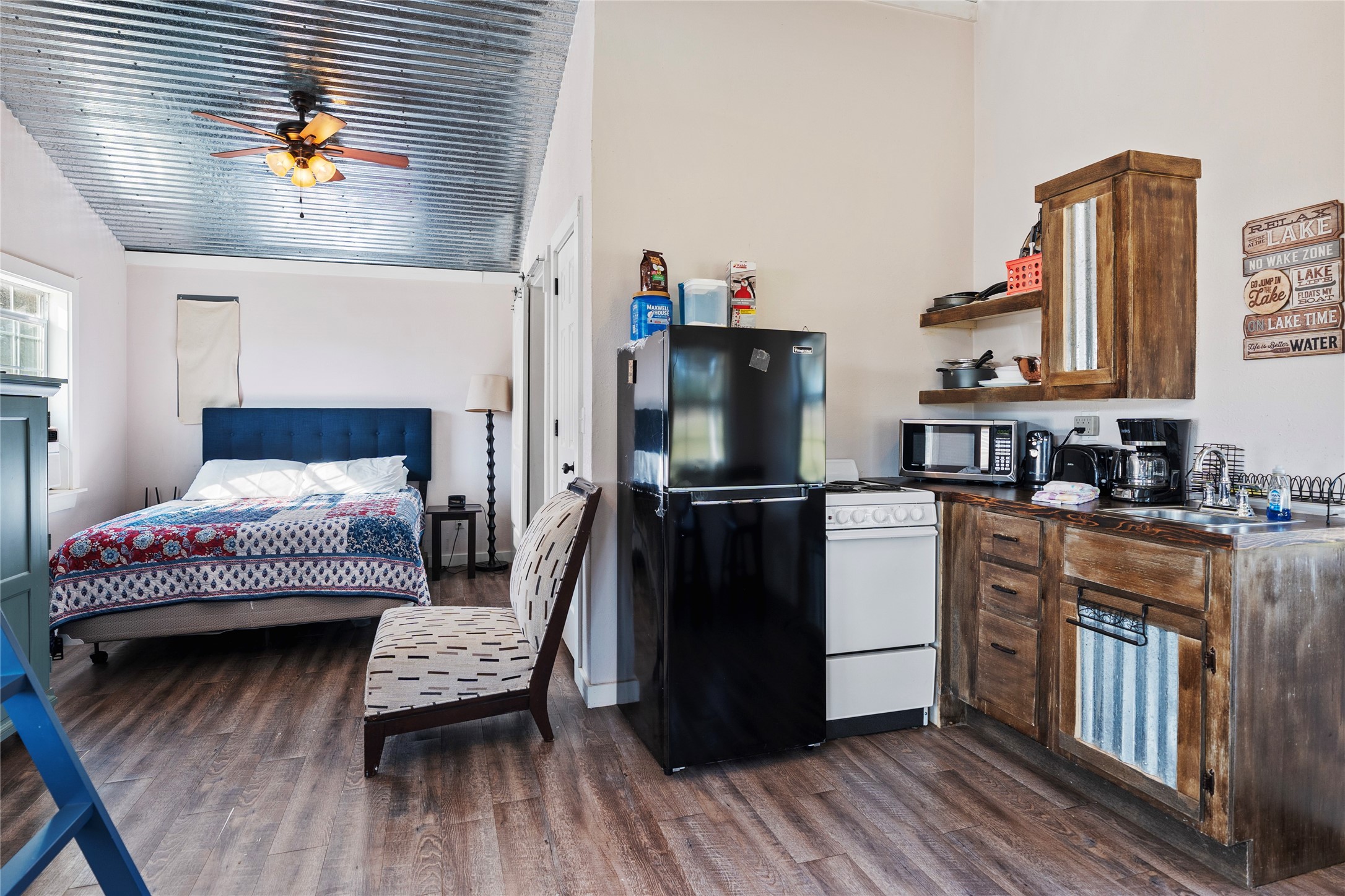 6776 Farm To Market Road 356 Trinity, TX 75862 - Photo 34 of 50 a living room with furniture and a wooden floor