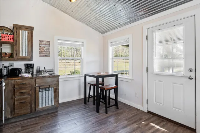 a view of a kitchen and dining room