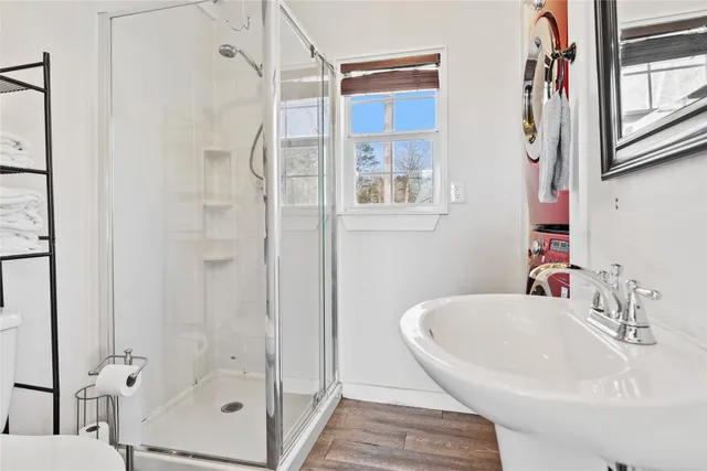 a bathroom with a tub and shower