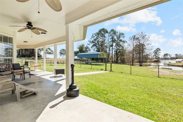 a view of a swimming pool and a yard