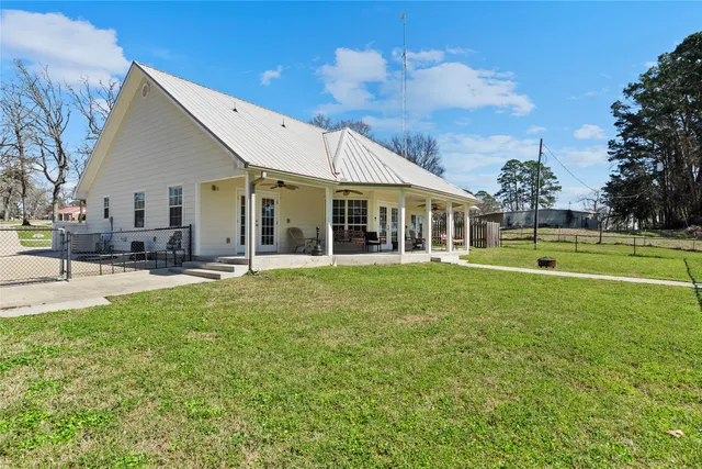 a view of a house with a big yard